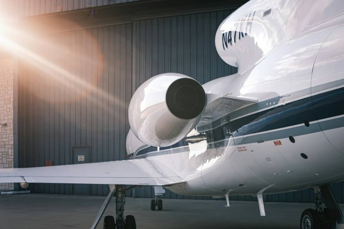 A business jet parked in a hangar