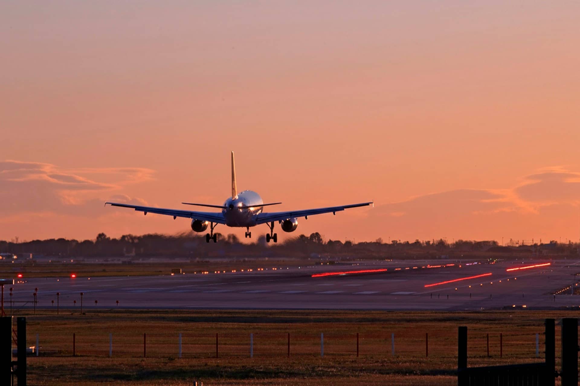 An airliner on short final at golden hour